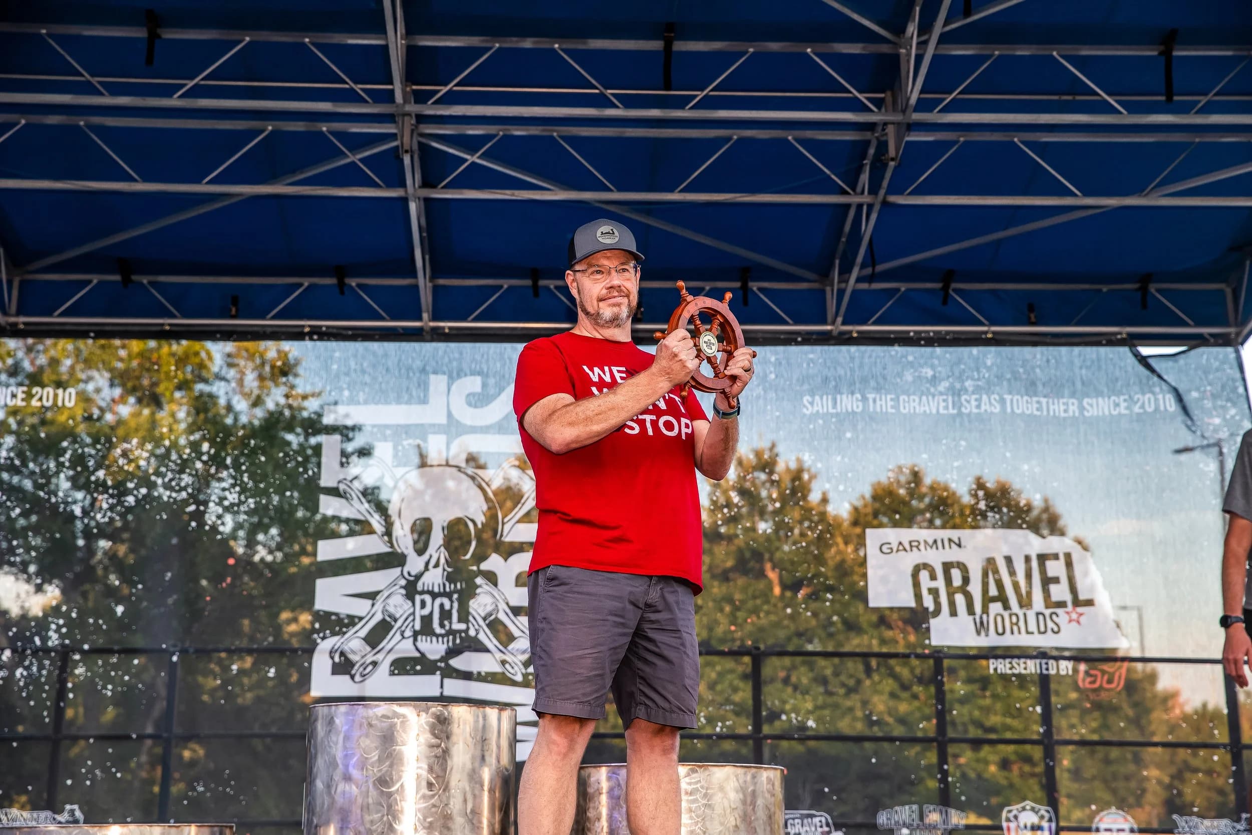 Mike Suiter receiving the 2023 Gravel Worlds Through Thick and Thin Award