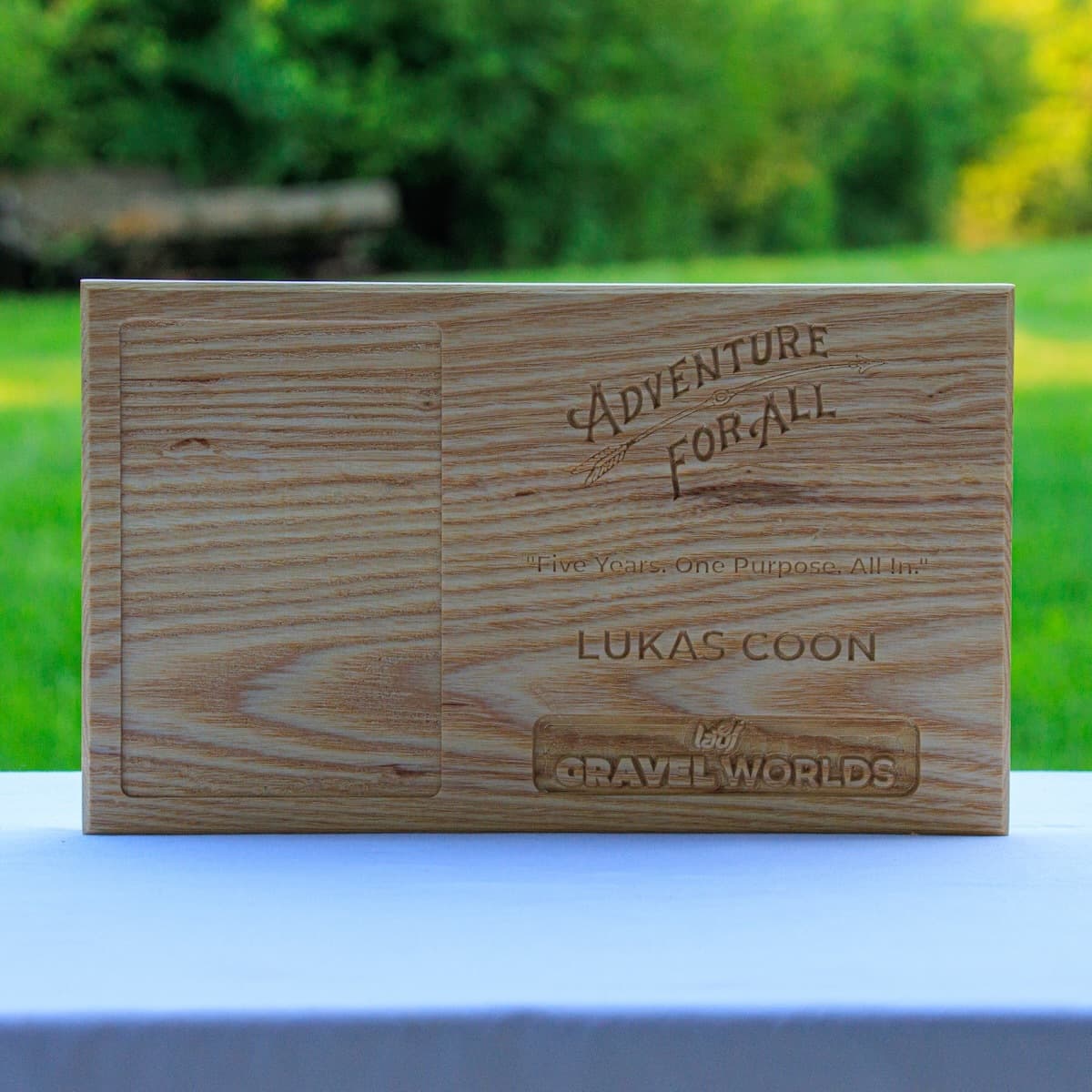 Trophy plaque for Lukas Coon showing CNC-routed design on ash wood with Adventure for All logo and Gravel Worlds badge.