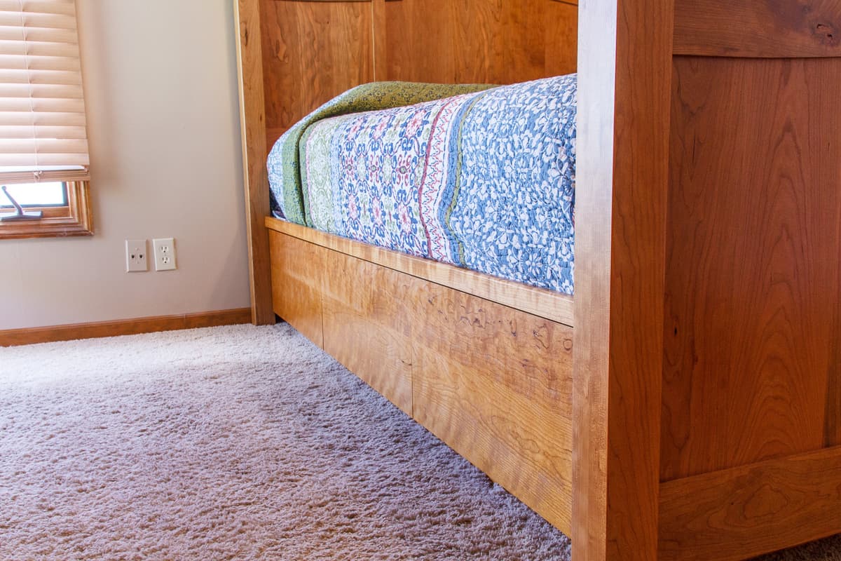 Low angle view of cherry bed footboard with built-in storage drawer