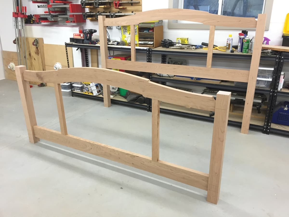 Unfinished bed frame assembly with curved rails and mortise-tenon joints