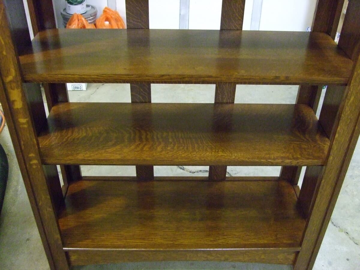 Interior detail of finished mission bookcase showing the front frame with mortise and tenon joinery connections and the rich color of the Shellac and Waterlox Satin finish