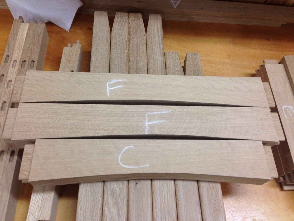 Coffee table frame clamped together with red bar clamps during glue-up process