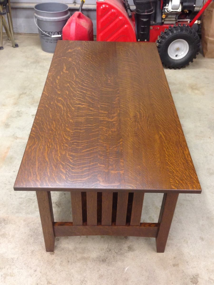 Mission coffee table side view showing straight grain lines and classic mission-style post legs