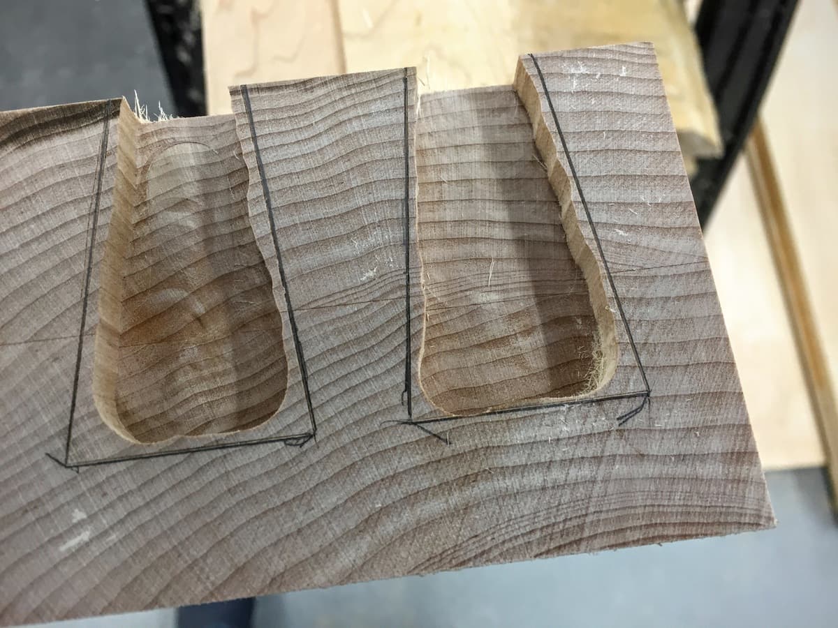 Workshop view of workbench leg showing mortise detail in partially assembled maple base with beautiful figure