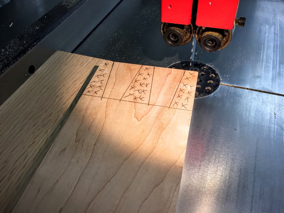 Detail of hard maple mortise showing precision hand-carved pocket joinery with scribed layout marks