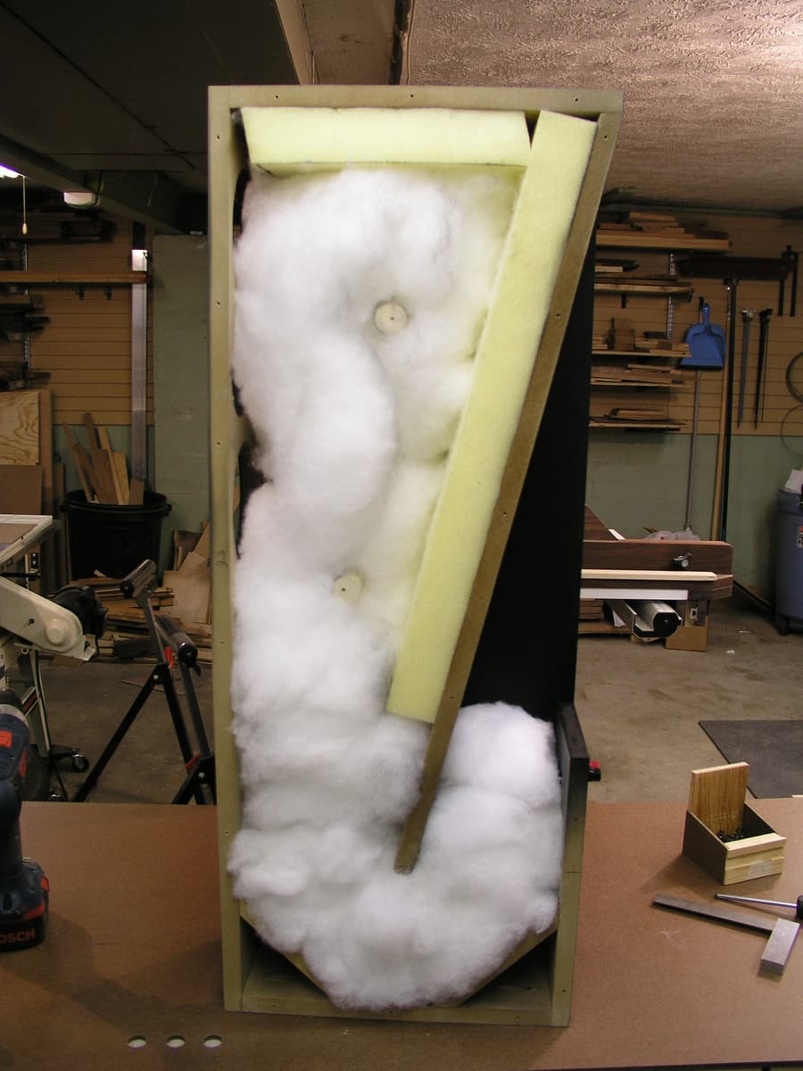 Tower speaker front view displaying red oak veneer detail and speaker elements