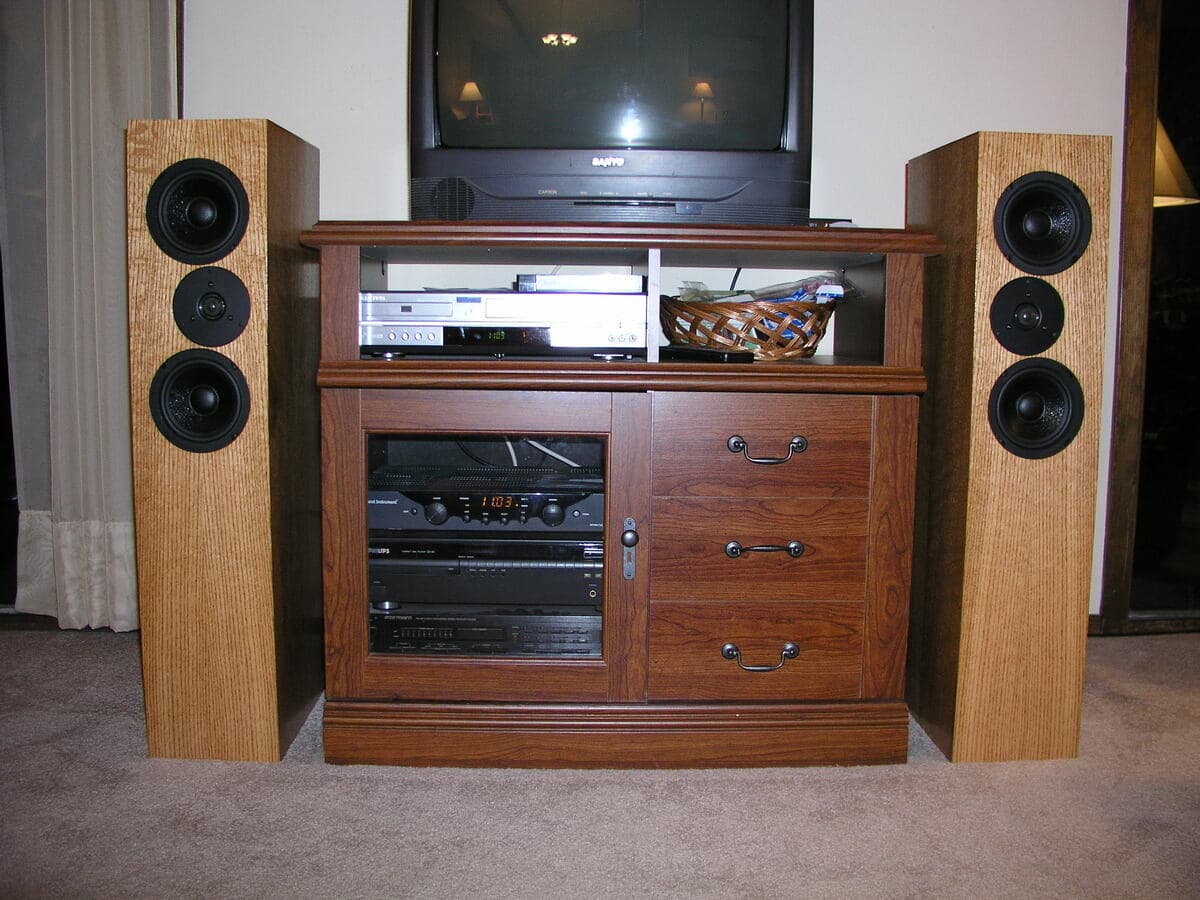 Pair of tower speakers displaying matching red oak construction and symmetric design