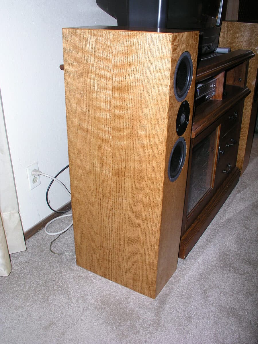Tower speaker detail view showing veneer joinery and cabinet craftsmanship