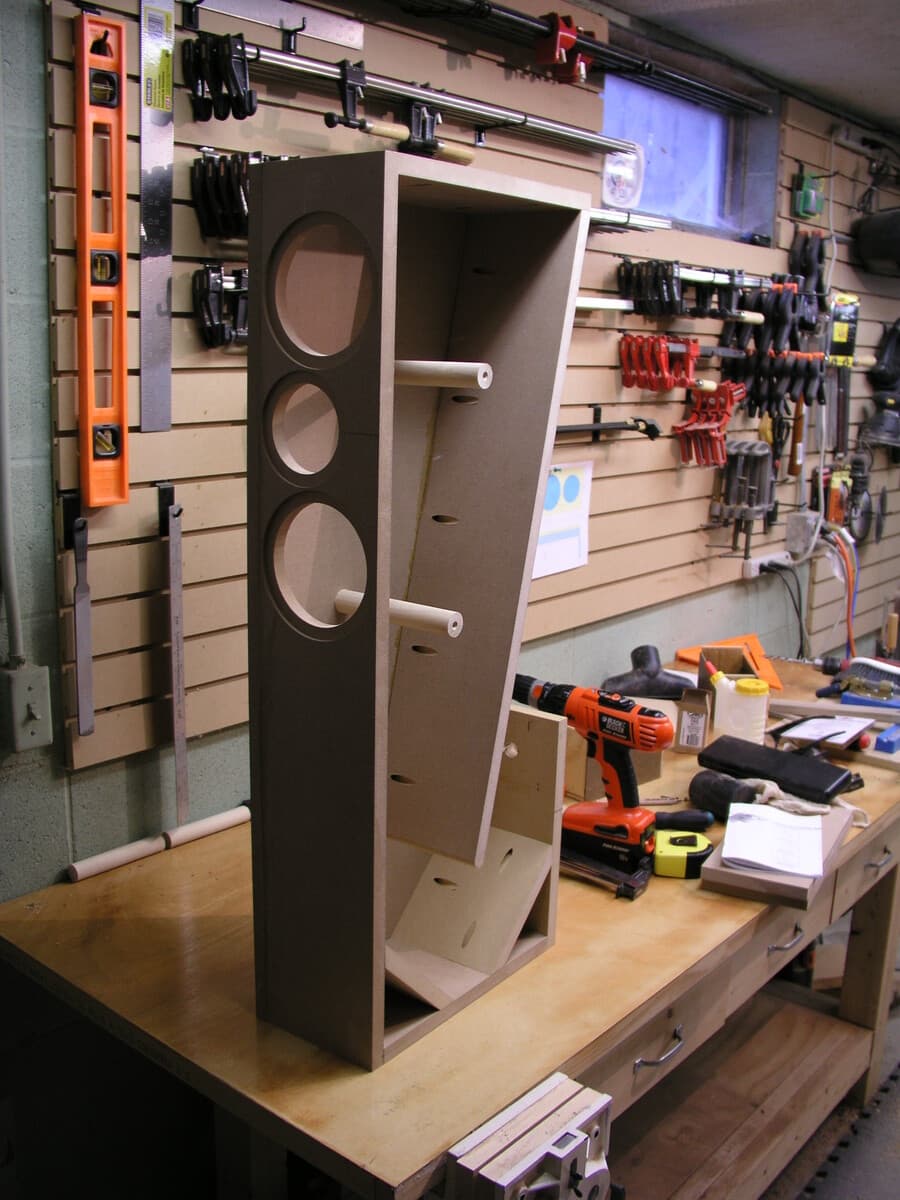 Tower speaker rear view showing cabinet assembly and veneer application